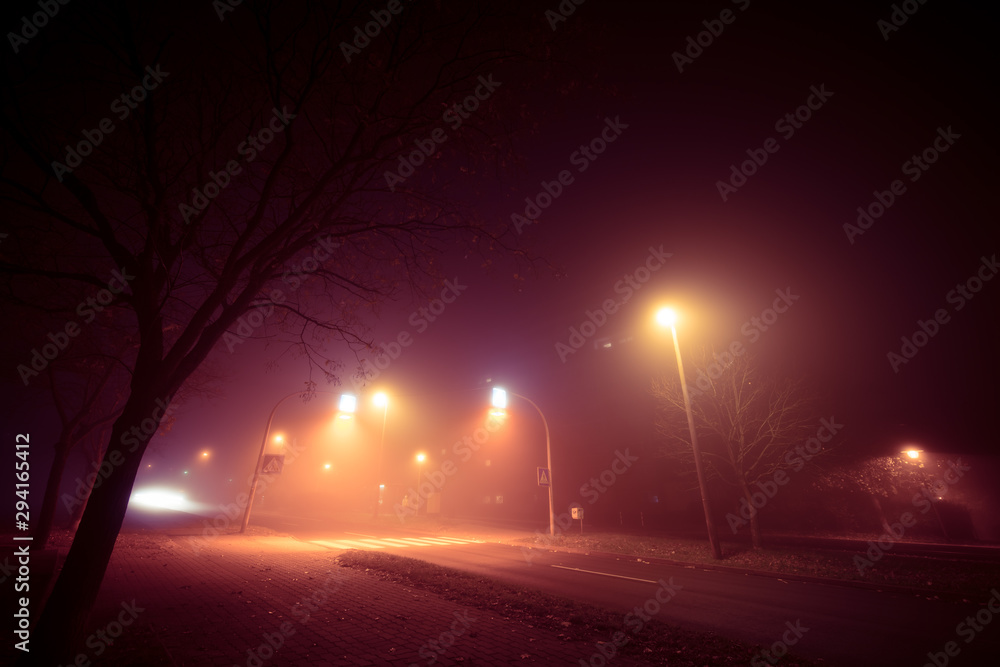 Fog at the crossroads in the night city