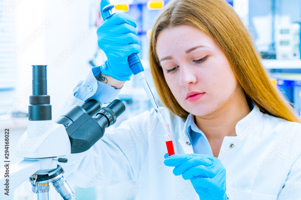 Girl lab technician at the clinic's microbiology laboratory Girl lab technician at the clinic's microbiology laboratory