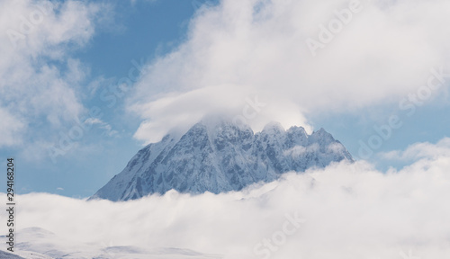 Panoramic snow mountain with white clouds and blue sky © SasinParaksa