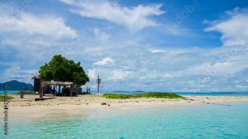 Sibuan island with turquoise water and beautiful beach at Semporna, Sabah. photo
