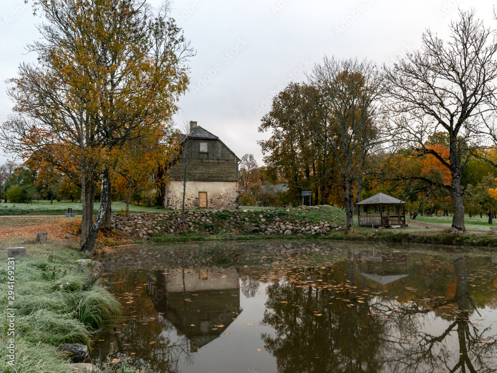 Fototapeta premium beautiful photograph with colorful trees on the water's edge, beautiful reflections, November
