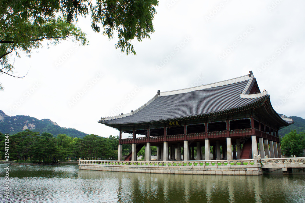 Ancient architecture surrounded by ponds inside a Korean palace