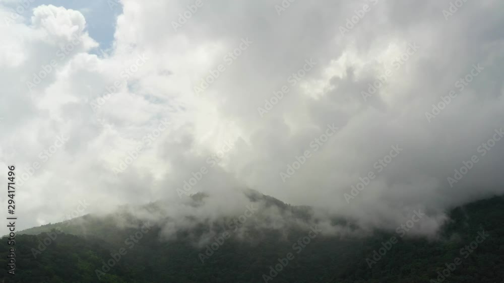 Aerial Hyperlapse Time lapse. Mountains lush in rain clouds covering mountains, tropical rainforests during the rainy season. Aerial Hyperlapse Time lapse. Mountains lush in rain clouds covering mountains, tropical rainforests during the rainy season.