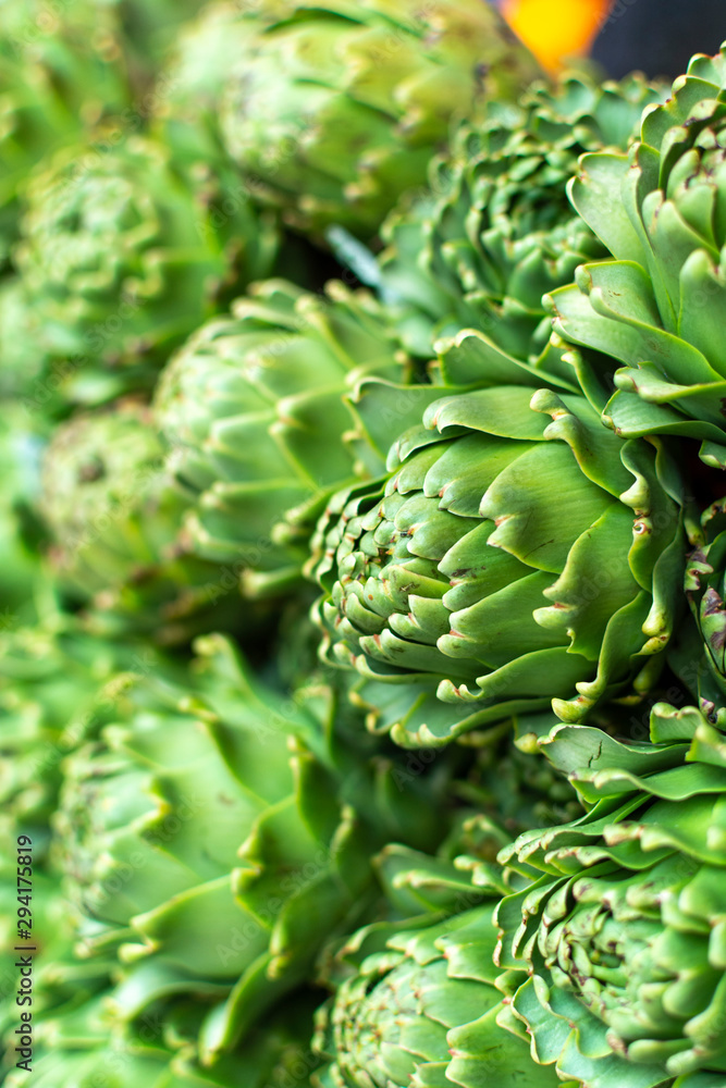 Bunch of fresh raw artichokes heads from artichoke plantation in Argolida, Greece on argicultural market in Nafplio Bunch of fresh raw artichokes heads from artichoke plantation in Argolida, Greece on argicultural market in Nafplio