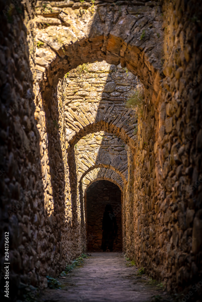 Jaca, Huesca / Spain »; September 29, 2019: Narrow corridors in the citadel of Jaca, vertical photo