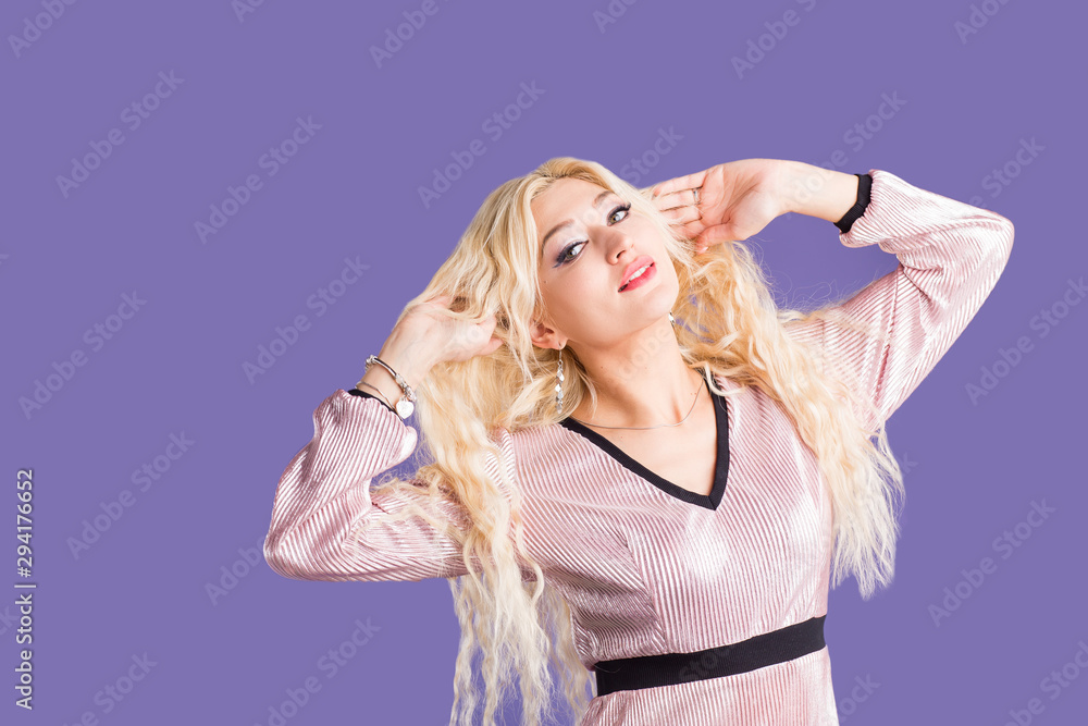 Beautiful young woman in sun hat on purple background Beautiful young woman in sun hat on purple background