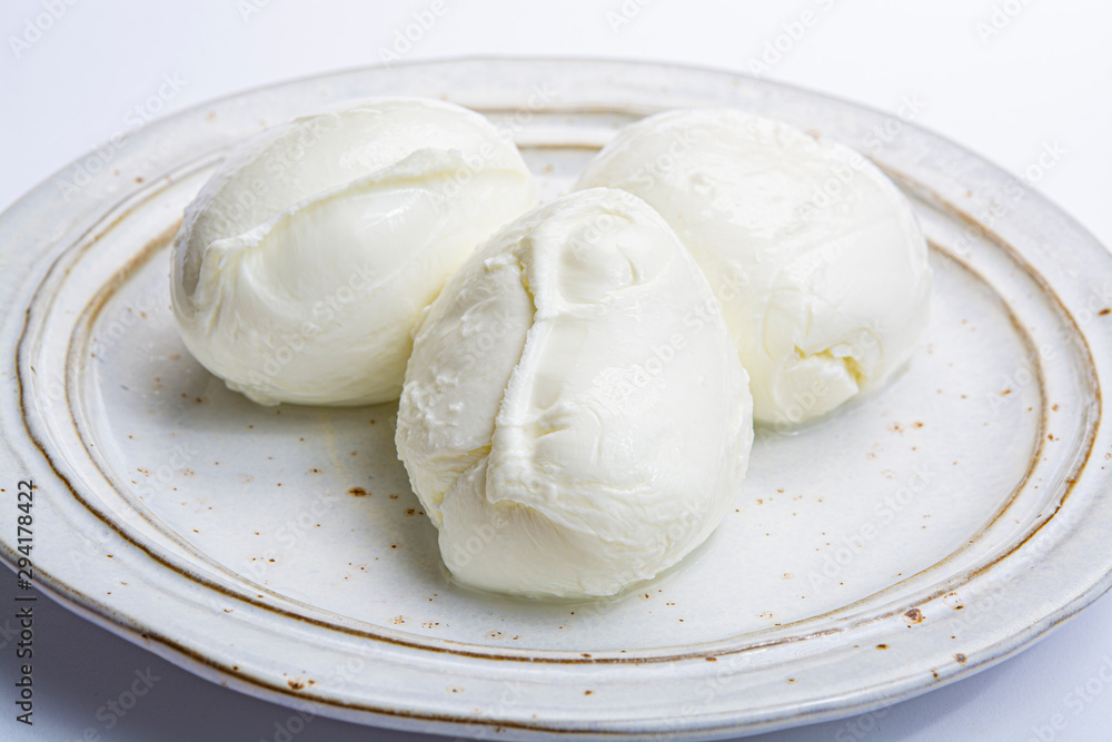 Italian soft cheese mozzarella, white cheese made from cow or buffalo milk Italian soft cheese mozzarella, white cheese made from cow or buffalo milk