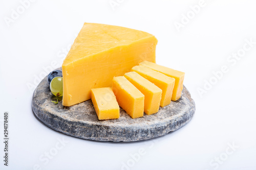 Cheddar cheese collection, piece of yellow Cheddar cheese made from cow milk
