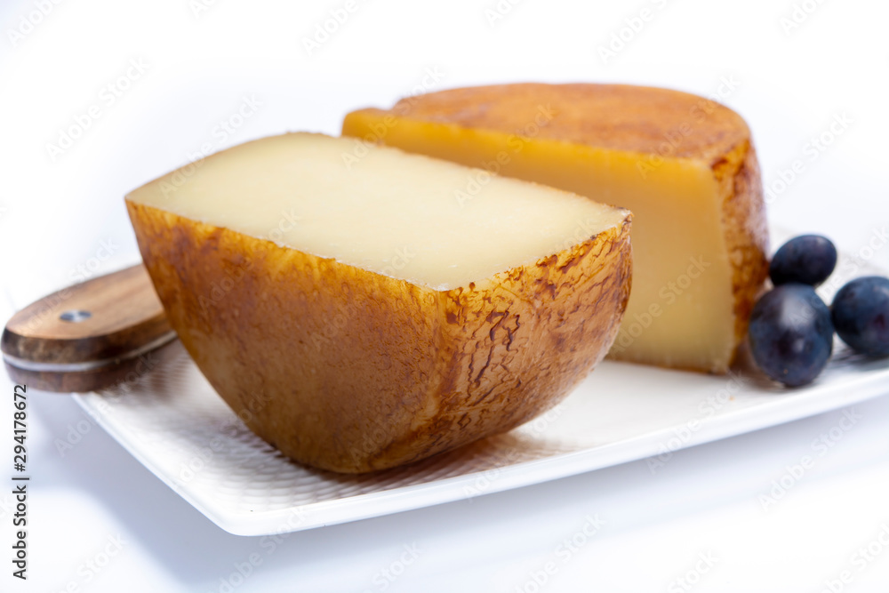 Hard Italian pecorino sheep cheese in two pieces