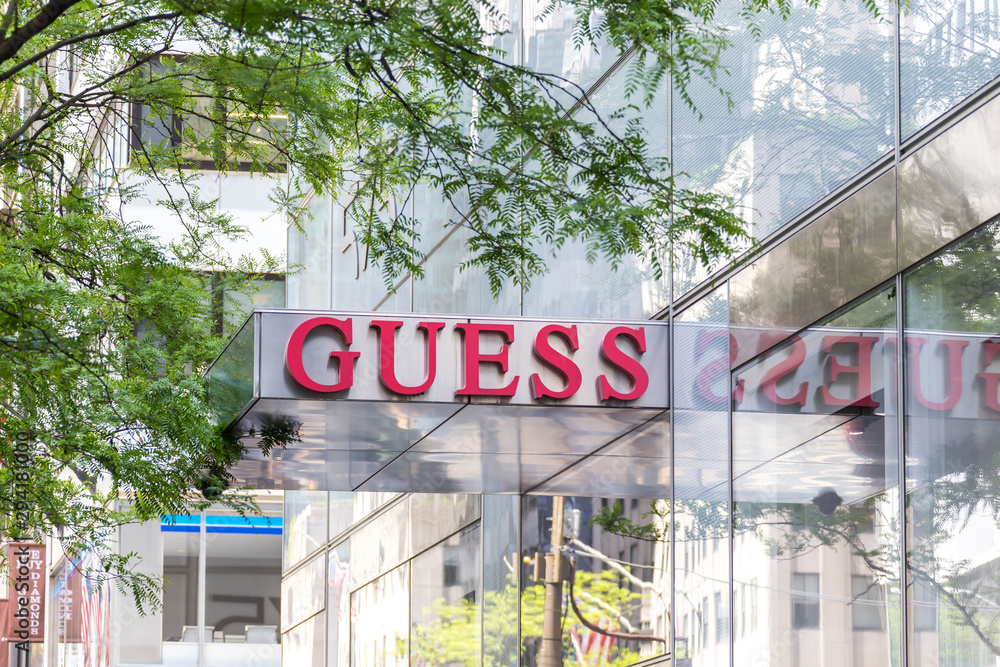 NEW YORK, USA - MAY 15, 2019: signboard of the Guess store in Manhattan.  Guess is an American clothing brand and retailer. Stock Photo | Adobe Stock