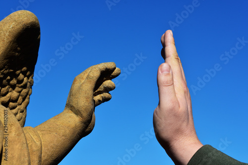 Man have a deal with a statue; two hands give five funny photo