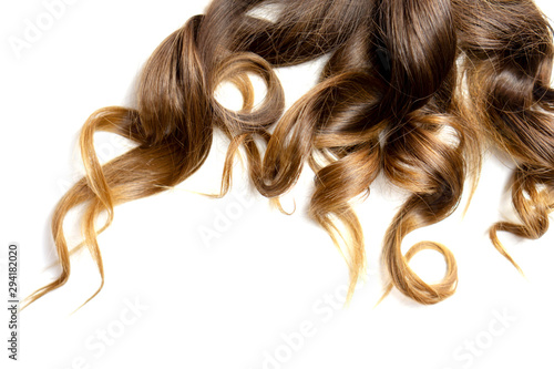 long brown curly hair on white isolated background