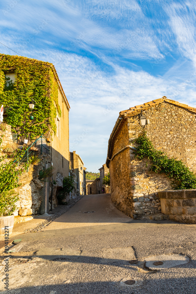 The medieval stone architecture and the old narrow street of Minerve, the most beautiful medieval village of France, located in the picturesque mountain valley in Pyrenees