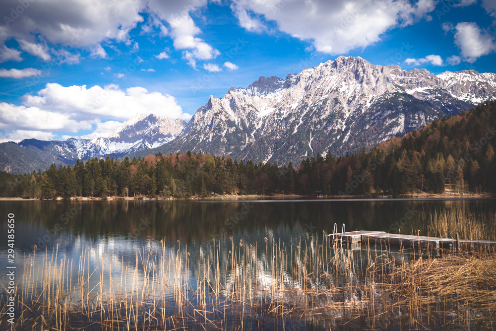 Mountain reflection and a footbridge