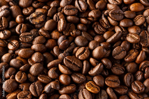 A lot of coffee beans. Seamless background from arabica beans. Fried arabica beans.