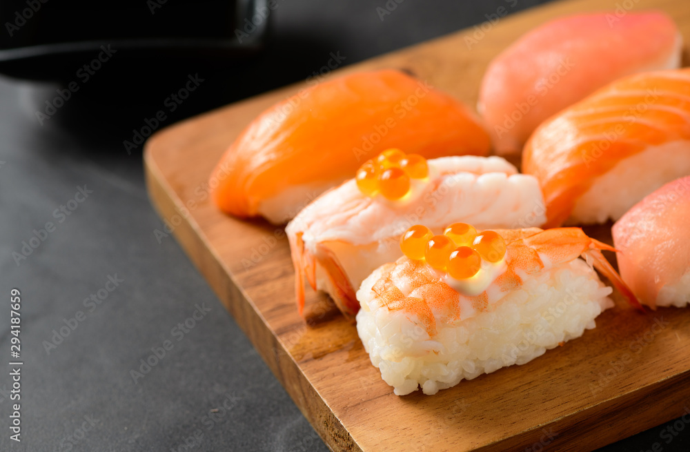 Ikura (salmon roe) on prawn sushi and sashimi sushi set Ikura (salmon roe) on prawn sushi and sashimi sushi set