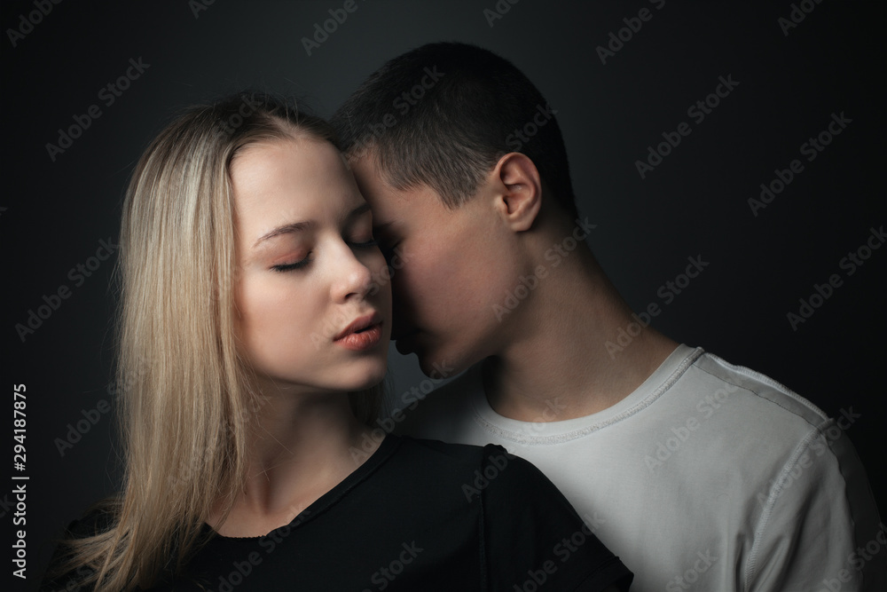 Young gentle couple in love. Studio portrait Young gentle couple in love. Studio portrait