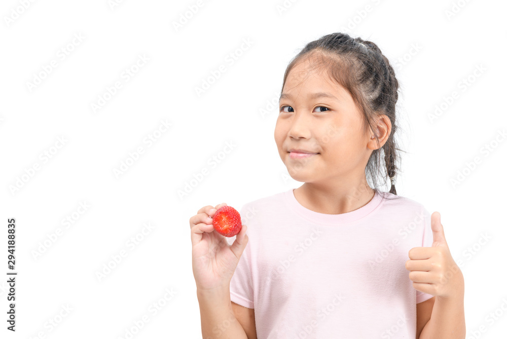 little cute asian girl holding a strawberry and showing thumb up, little cute asian girl holding a strawberry and showing thumb up,