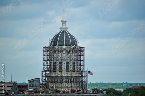 Workers On Scaffolding Outside Building