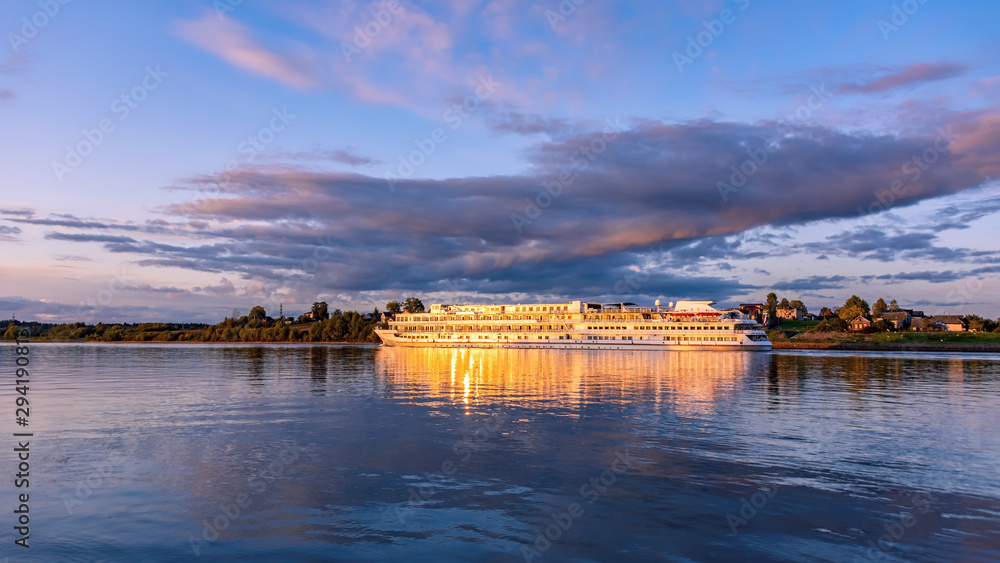 Cruise ship on the River at sunset	