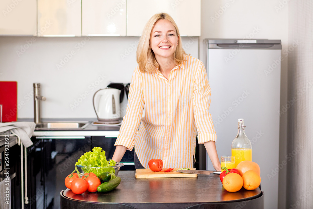 Young woman cooking in the kitchen