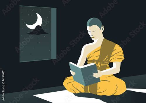 monk read Dharma book at night in temple to study Buddha teach to be out of suffer,a routine of priest