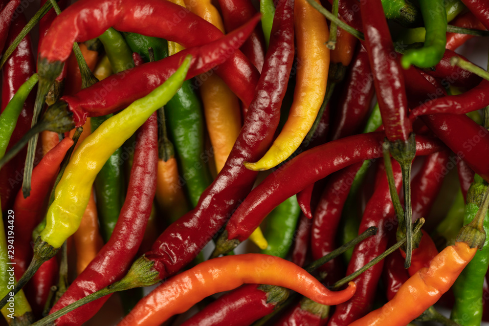 Bunch of colourful chillies seen from above