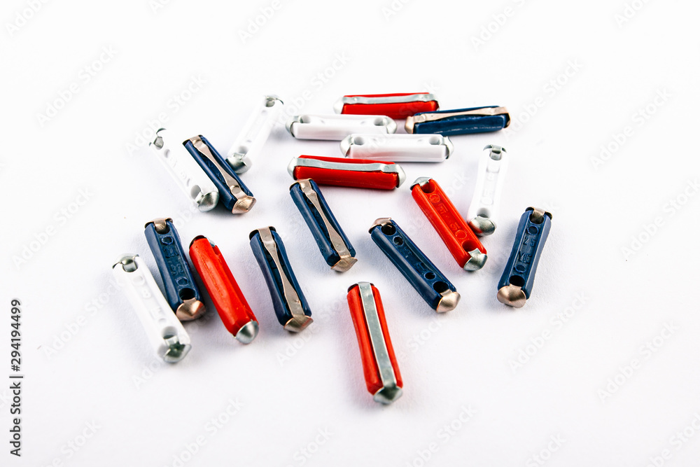 Torpedo fuses different ampers on isolated white backgrounds. Electric car parts.