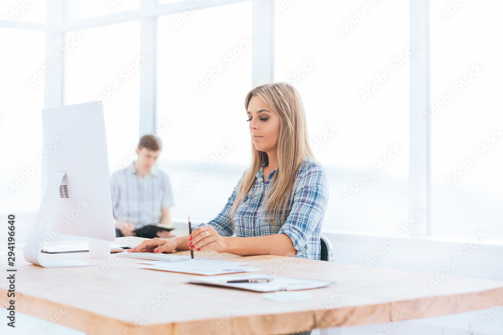 young businesswoman working with documents in a modern office. young businesswoman working with documents in a modern office.