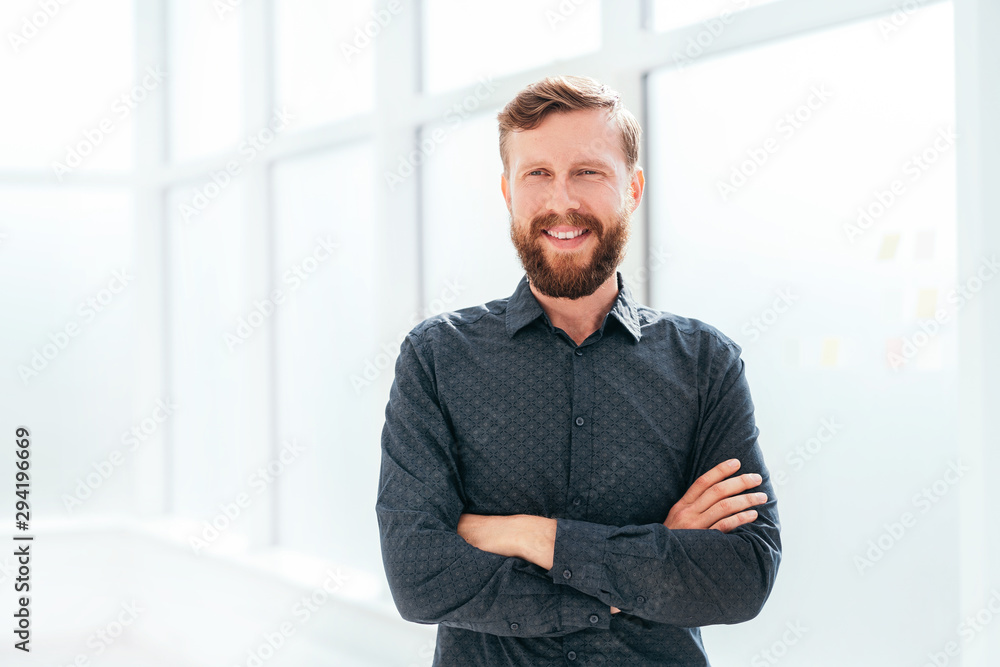 Fototapeta premium successful businessman standing near the office window