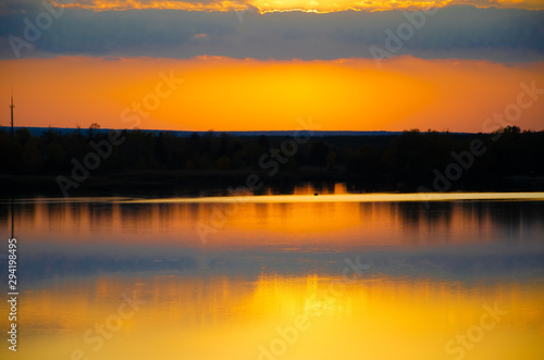 orange sunset on a blue lake
