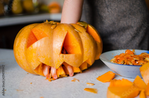 Carved pumpkins into jack-o-lanterns for halloween, decoration and holidays concept