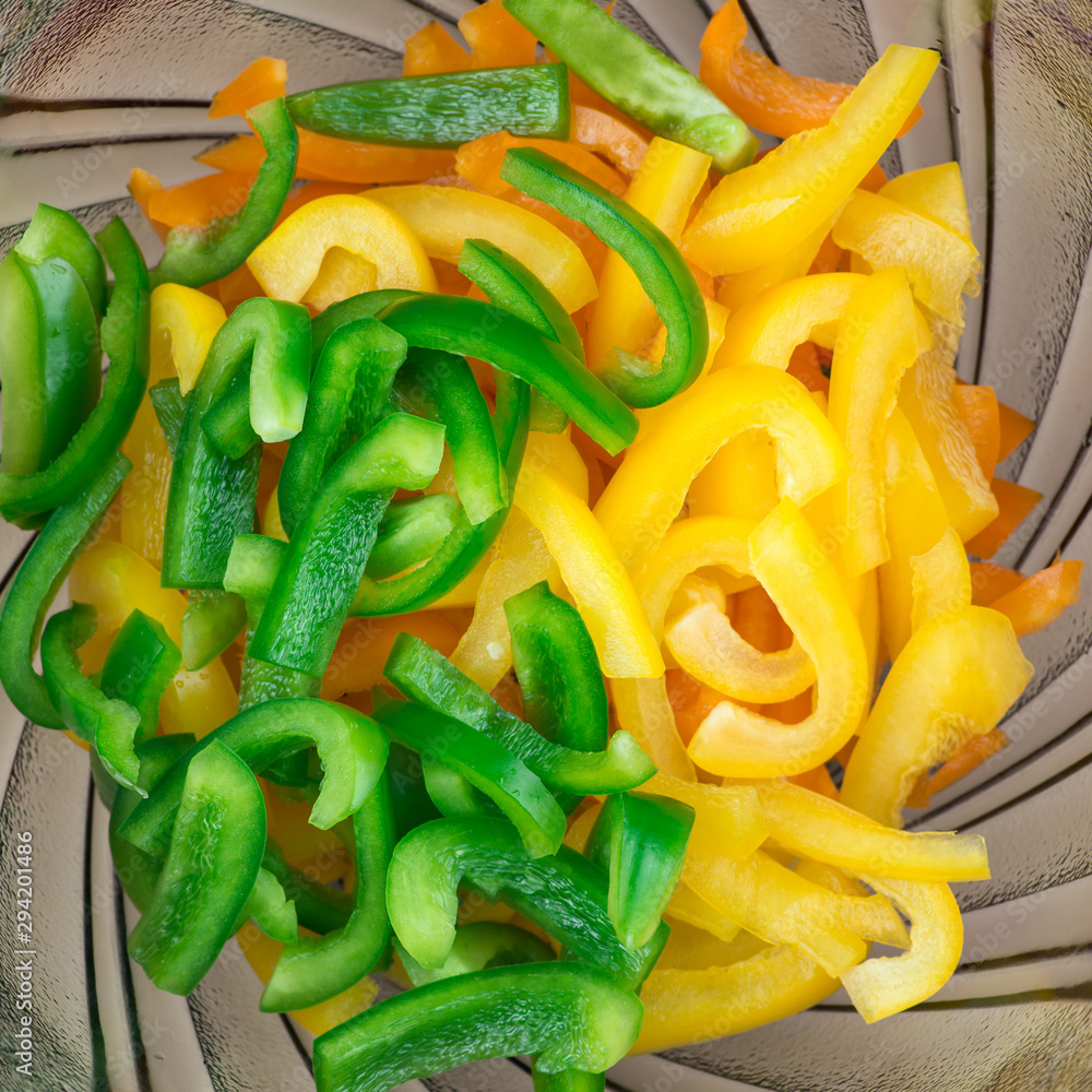 Sliced pepper. Slices of yellow and green bell peppers Sliced pepper. Slices of yellow and green bell peppers
