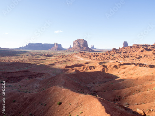 Panoramic view of Monument Valley, Utah, USA on a hot sunny day with the view of  West Mitten Butte, East Mitten Butte, and Merrick Butte