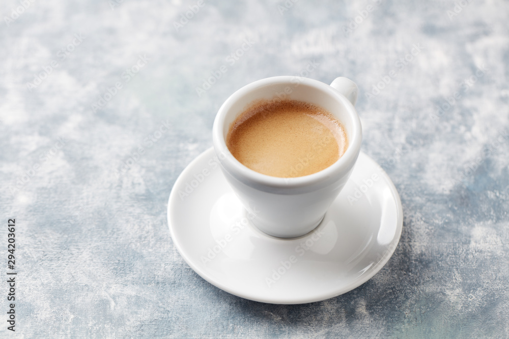 Cup of coffee on bright wooden background. Copy space. Cup of coffee on bright wooden background. Copy space.