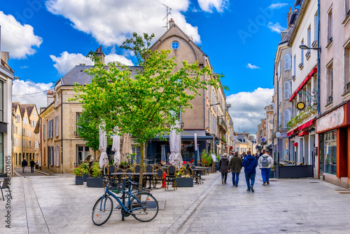 Old street with old houses and tables of cafe in a small town Chartres, France photo