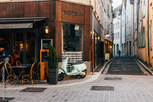 Fototapeta Naklejka Na Ścianę i Meble -  Old street with old houses and tables of cafe in a small town Chartres, France
