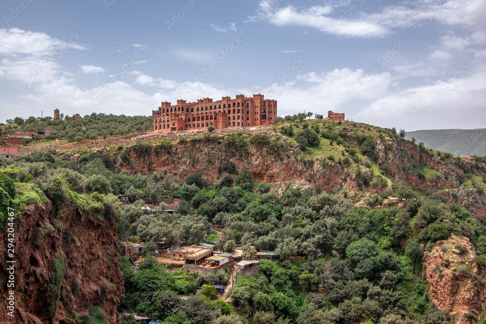 Landscape view of touristic area waterfall with hotel complex on the top of the area, Ouzoud Falls. Moyen Atlas village of Tanaghmeilt, Atlas mountains, Morocco.