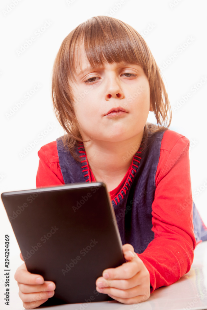 Learn аlways and everywhere concept. Cute little child girl with e book Learn аlways and everywhere concept. Cute little child girl with e book