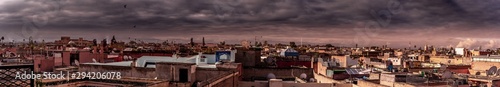 Panoramic view from above on city buildings and roofs. Marrakech, Morocco.
