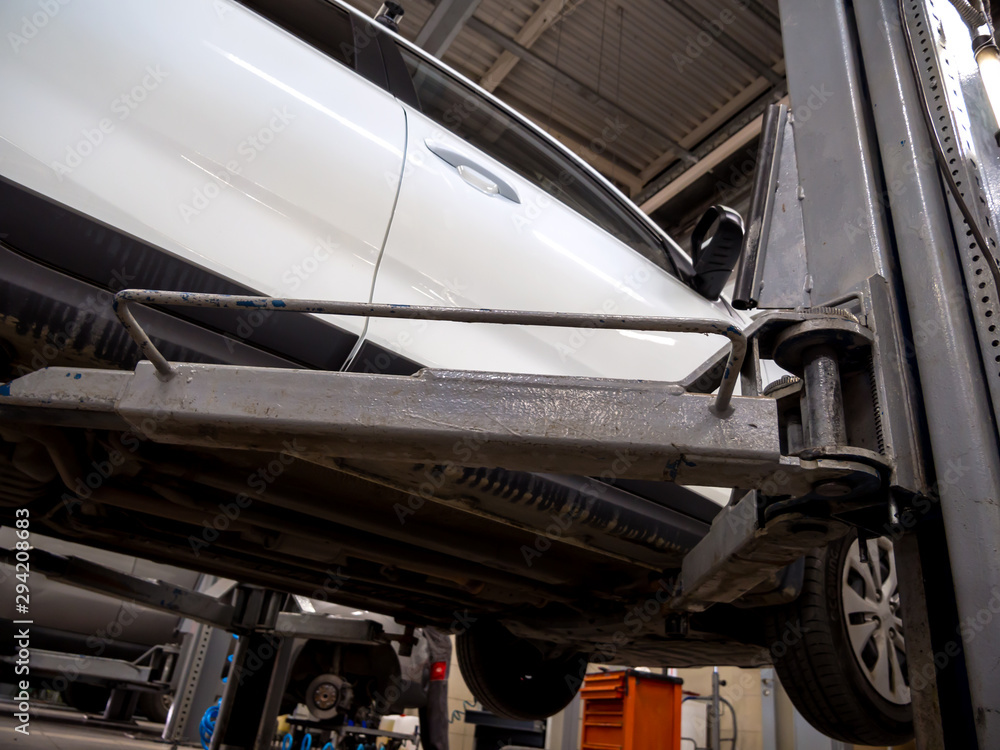 The car is mounted on a hydraulic lift The car is mounted on a hydraulic lift