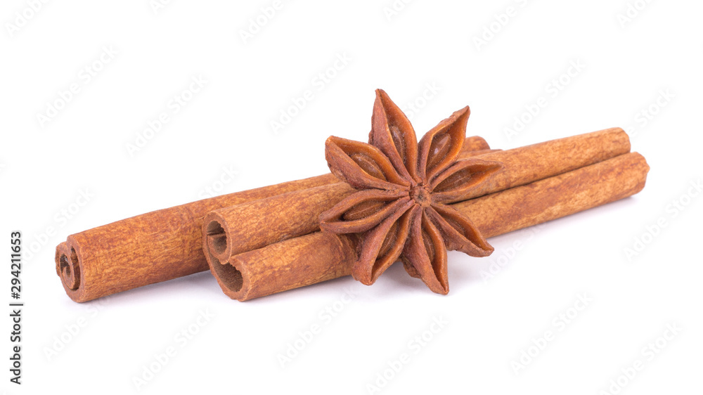 Spicy Cinnamon Sticks and Anise isolated on White background closeup macro shot Spicy Cinnamon Sticks and Anise isolated on White background closeup macro shot