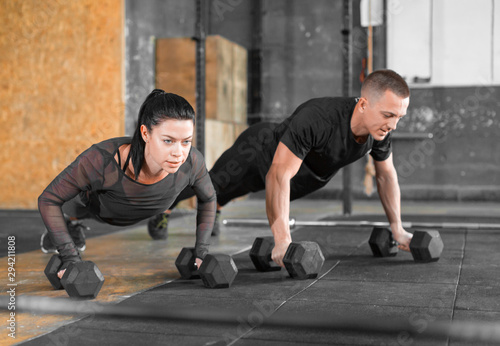 Gym man and woman push-up. Strength pushup, Workout.