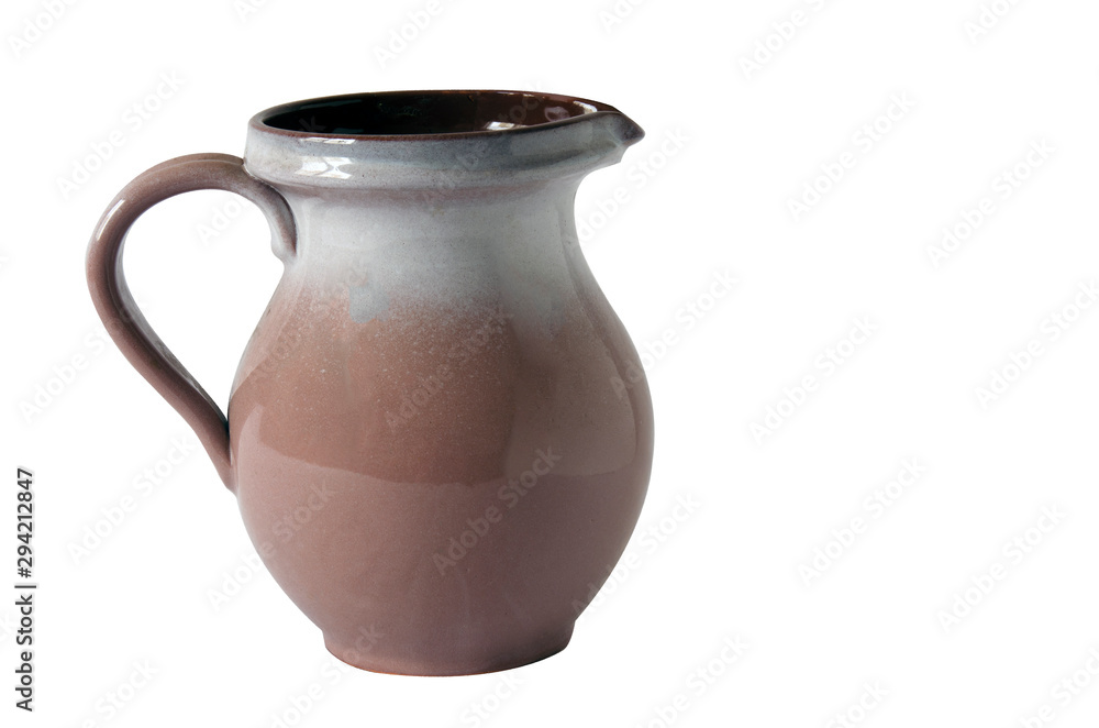 Brown glossy jug with handle isolated on white background.