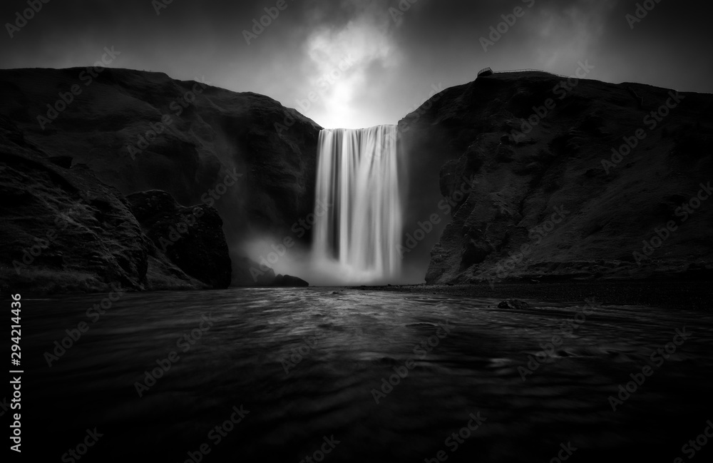 Black and white view to stunning Skogafoss waterfall - obrazy, fototapety, plakaty 