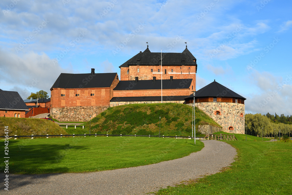 Medieval fortress on coast of picturesque lake Vanajavesi in Linnanpuisto park, Hameenlinna, Finland