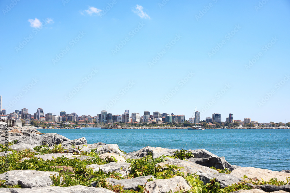 Beautiful view of city near sea on sunny day