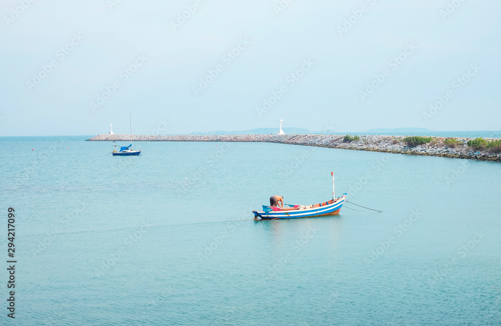 Man on fishing boat in the sea