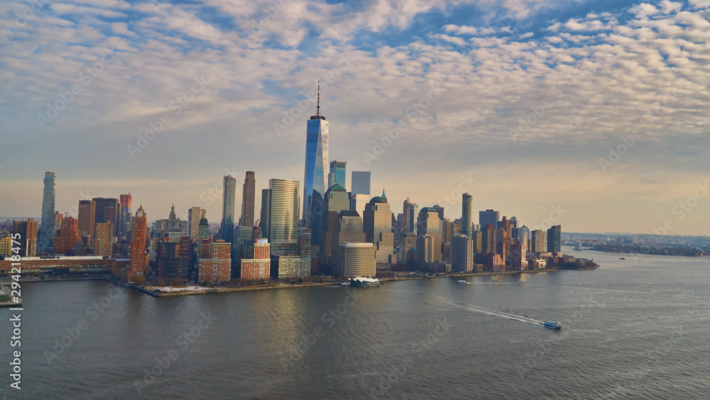 Aerial view of lower Manhattan financial district with modern architecture office buildings shot from helicopter at golden hour Aerial view of lower Manhattan financial district with modern architecture office buildings shot from helicopter at golden hour