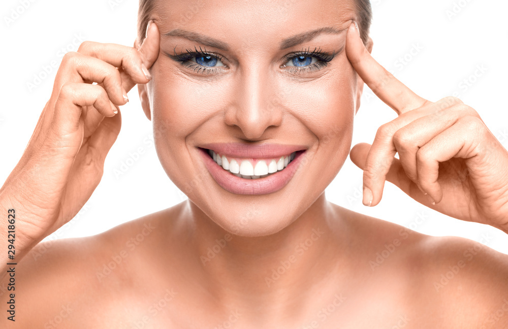 Happy woman enjoying in her healthy skin. Woman touching her face.